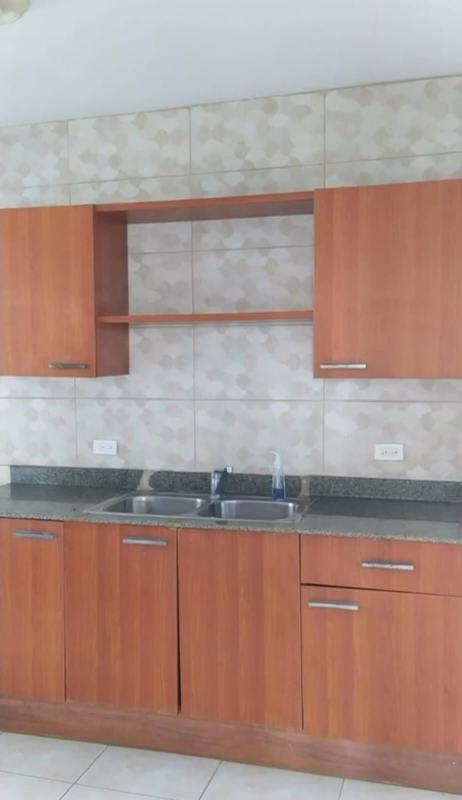 Contemporary kitchen with granite counter, wood cabinets in PH San Francisco Bay Panama