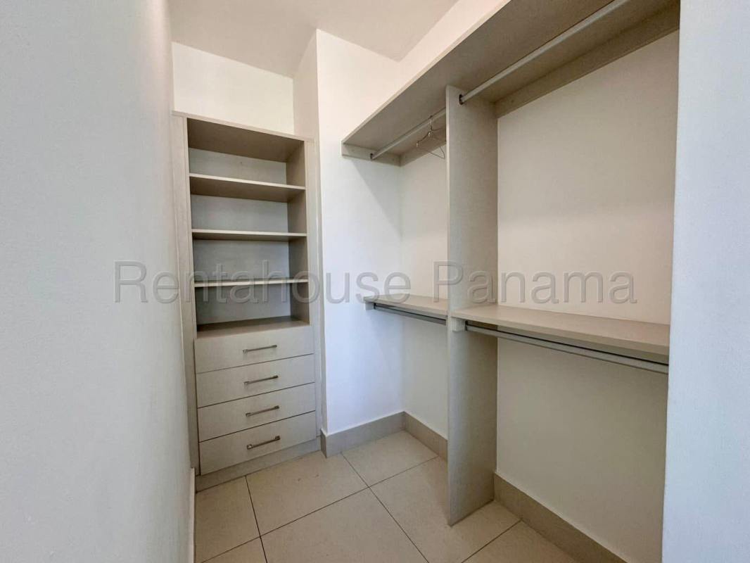 Furnished living area with balcony, skyline views, TV and modern furniture at PH Costa View Tower