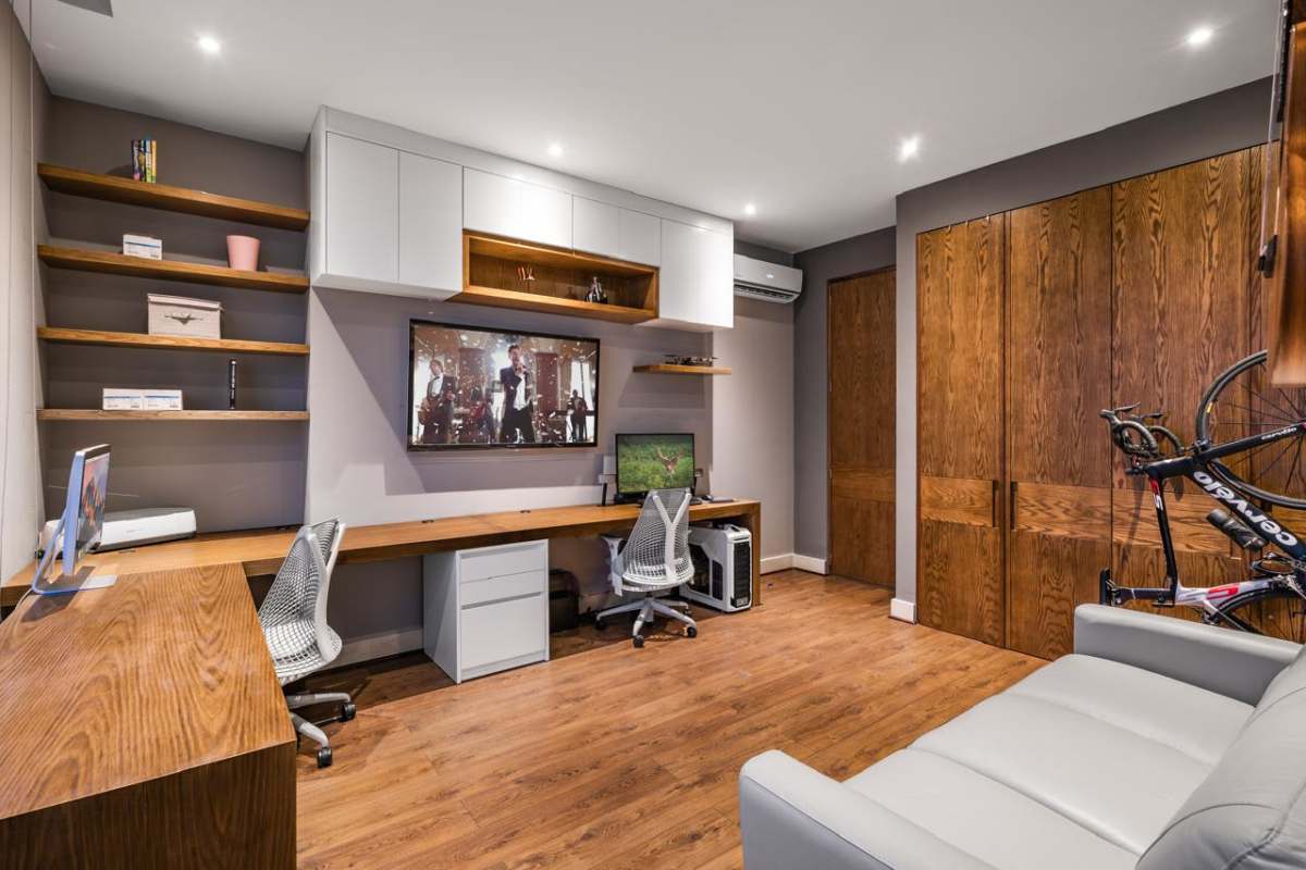 Large balcony with glass railing featuring panoramic ocean and city skyline views in PH Aria Costa del Este Panama