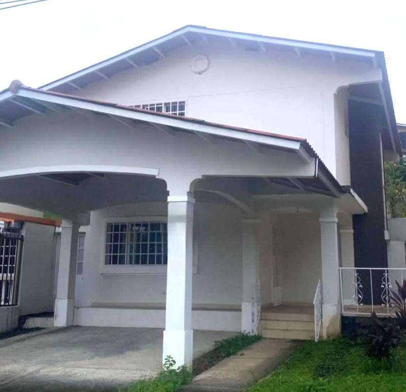 Covered porch arched columns carport in duplex house Villa Zaita Panama