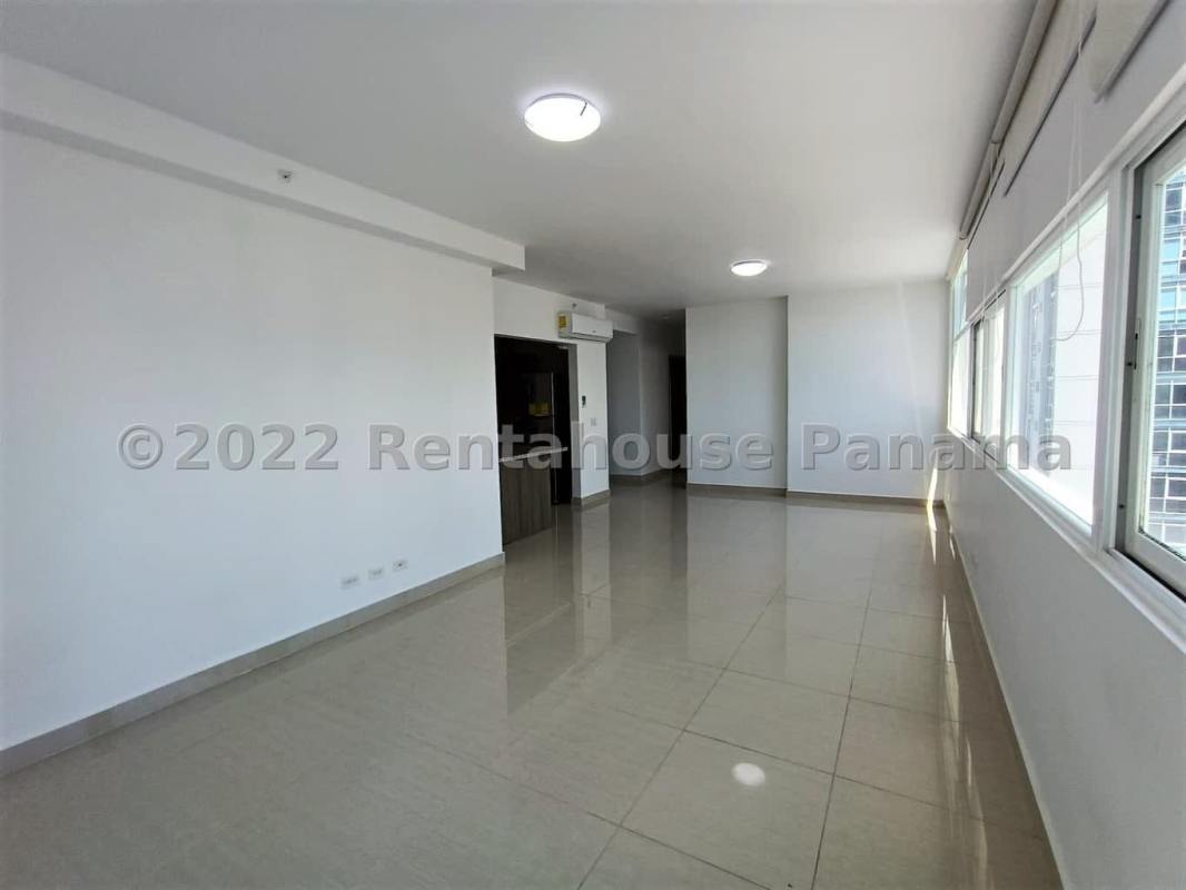 Open living dining room with floor-to-ceiling windows ocean views PH Bellavista Tower Panama