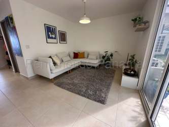 Bright open-plan living room with ceramic floors and large windows in Bosques del Pacífico Panama Pacifico