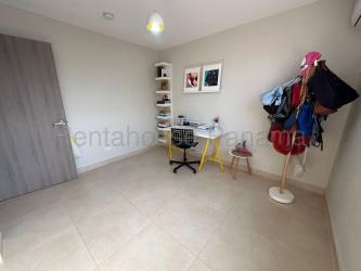 Master bedroom with large closet and ensuite bathroom in Bosques del Pacífico townhouse Panama Pacifico