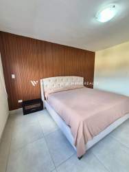 Bedroom with large window, bunk beds, tiled floors in rental Panama Pacifico