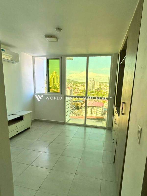 Bedroom with large window, built-in closet, AC at PH Metropolitan Park Panama City