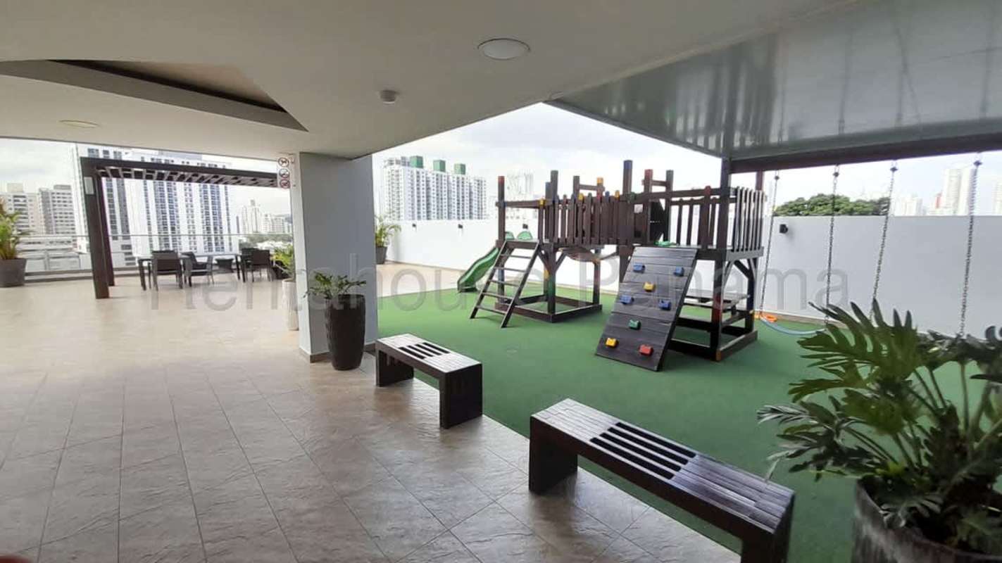 Outdoor playground terrace with play equipment and pergola seating PH Vista Verde Panama
