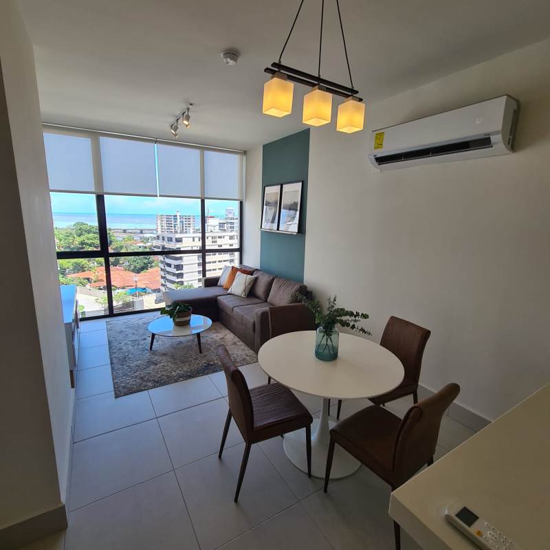 Bright furnished living dining area with ocean city view and balcony PH Coco Place Coco del Mar Panama