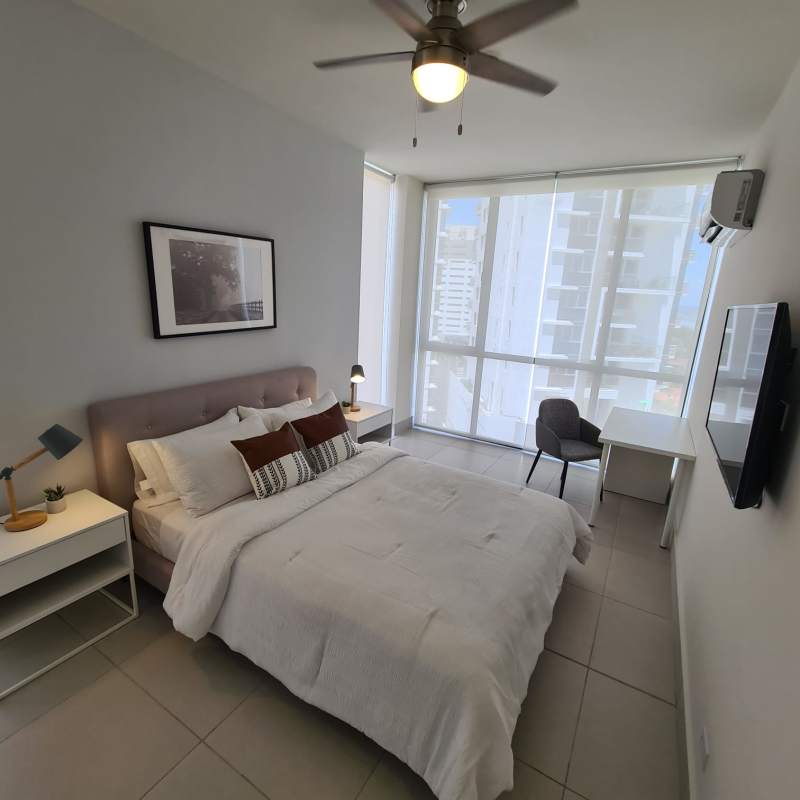 Rooftop terrace with jacuzzi, seating and ocean skyline view at PH Coco Place Panama