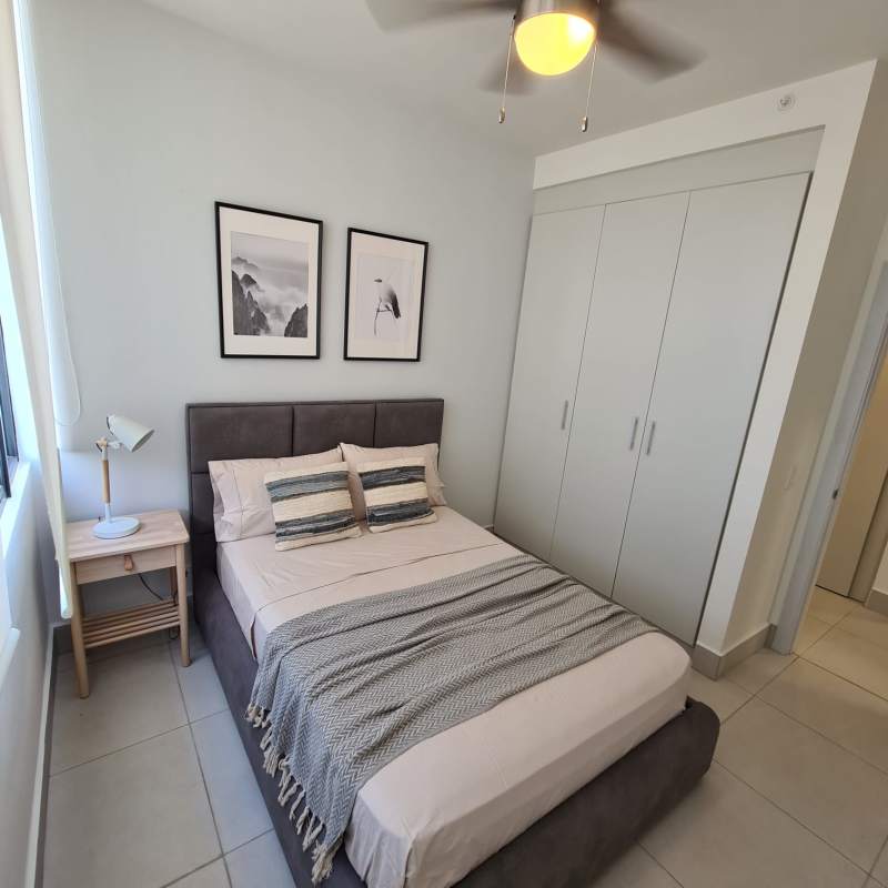 Bedroom with large closet, ceiling fan, AC and window in Coco Place Panama