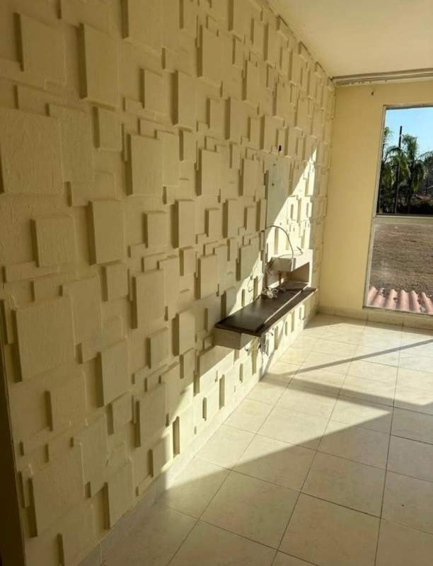 Compact kitchen-utility with accent wall, window, ceramic tile in PH Praderas del Rocio Villa Zaita