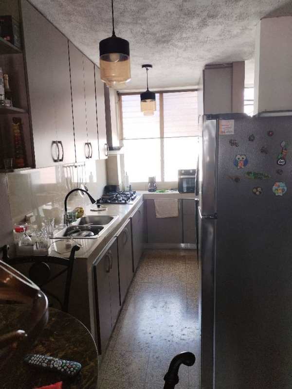 Hallway with built-in wardrobes leading to bright rooms Carrasquilla Panama