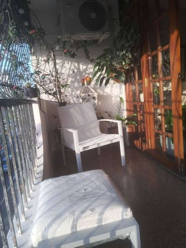 Open living and dining room with sofa, breakfast bar and TV Carrasquilla Panama