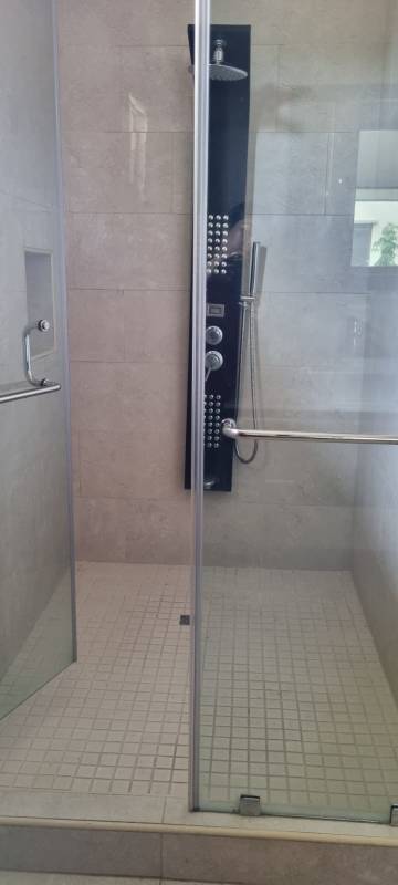 Spacious kitchen with large windows, granite counters, island sink, high-end appliances in Clayton Residences Panama