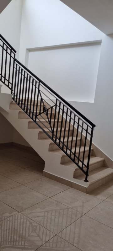 Luxury bathroom with walk-in glass shower, marble tiles and modern fixtures in Clayton house Panama