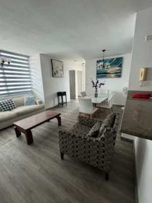 Contemporary kitchen with granite countertop, appliances, white cabinets PH Barcelona View Panama City