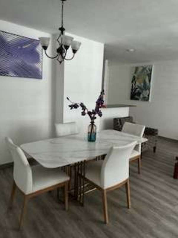 Spacious master bedroom with built-in wardrobe, wood patterned floor in PH Barcelona View Carrasquilla