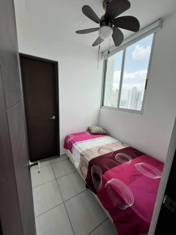 Bedroom with city view large window, ceiling fan, tiled floor at PH Trinity Tower