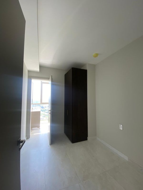 Modern dark wood walk-in closet with LED lights and built-in drawers La Maison Santa Maria Panama