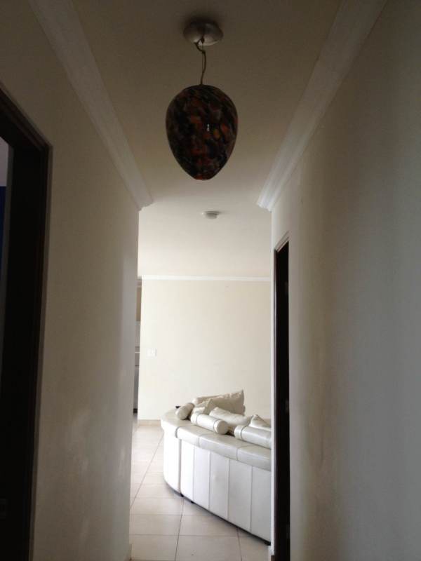 Interior hallway with ceiling light leading to bright living room in PH Onyx Panama