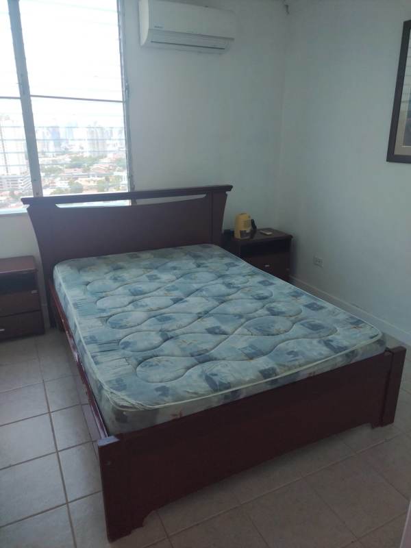Dining space with tile floors connected to living room and balcony in PH Blue Tower Miraflores