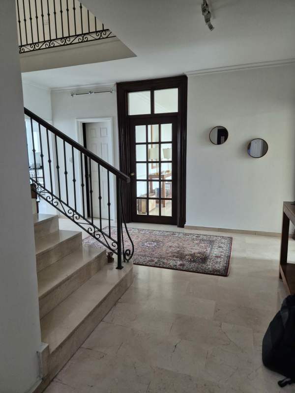 Large kitchen with granite countertops and breakfast area in PH Brisas Marbella Panama Penthouse