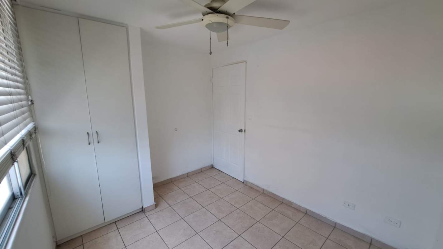 Bedroom with ceiling fan, built-in closet, tiled floor PH La Loma Residences Panama City