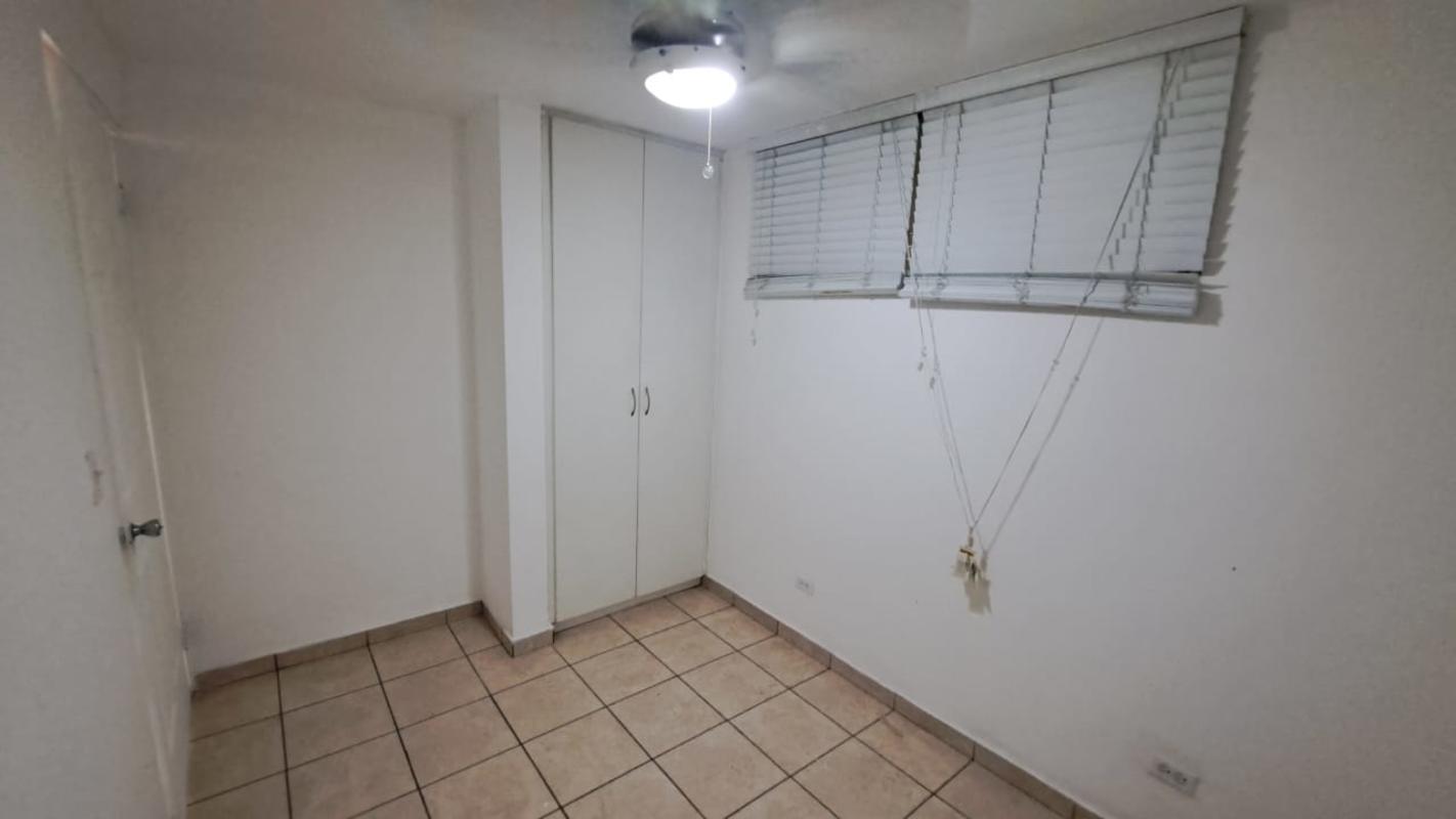 Second bedroom white walls, ceiling fan, built-in closet, tiled floors PH La Loma Panama City
