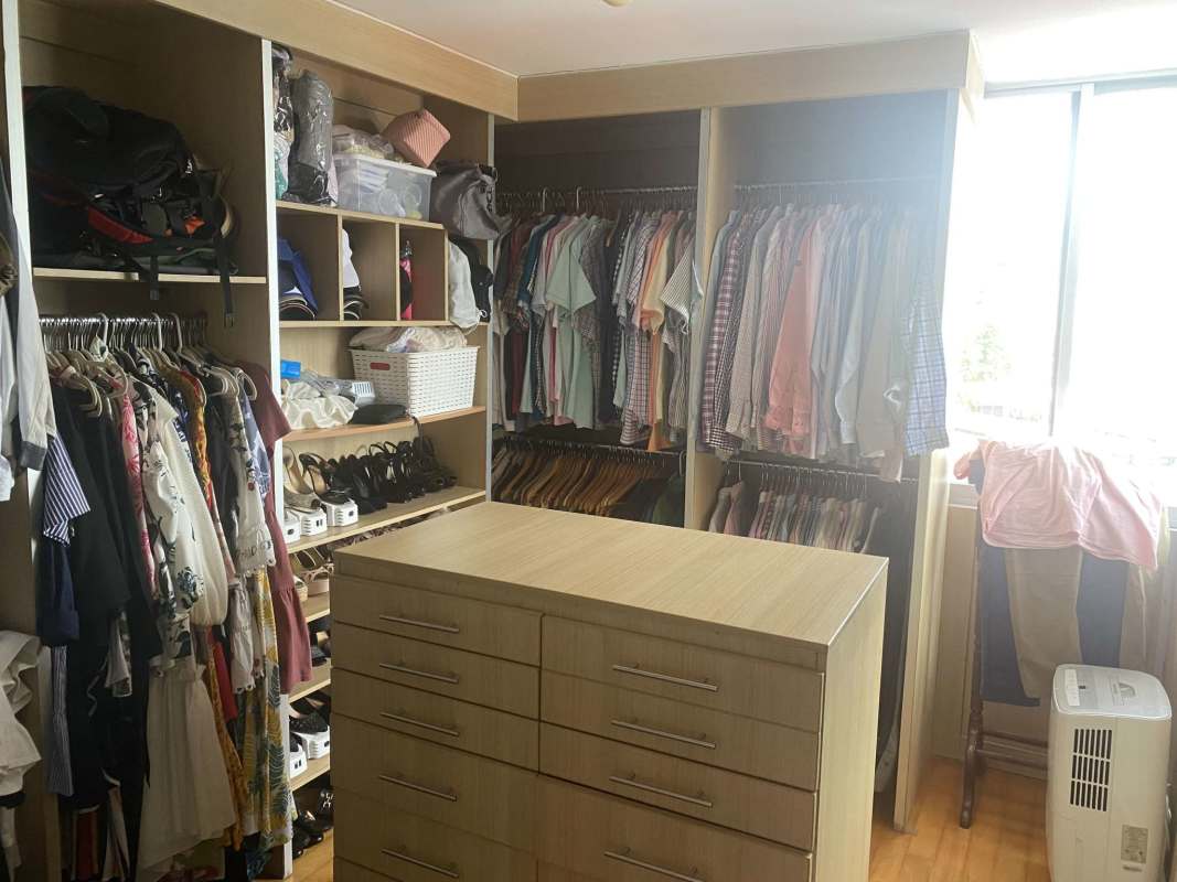 Spacious walk-in closet with natural lighting PH Las Llamas Coco del Mar