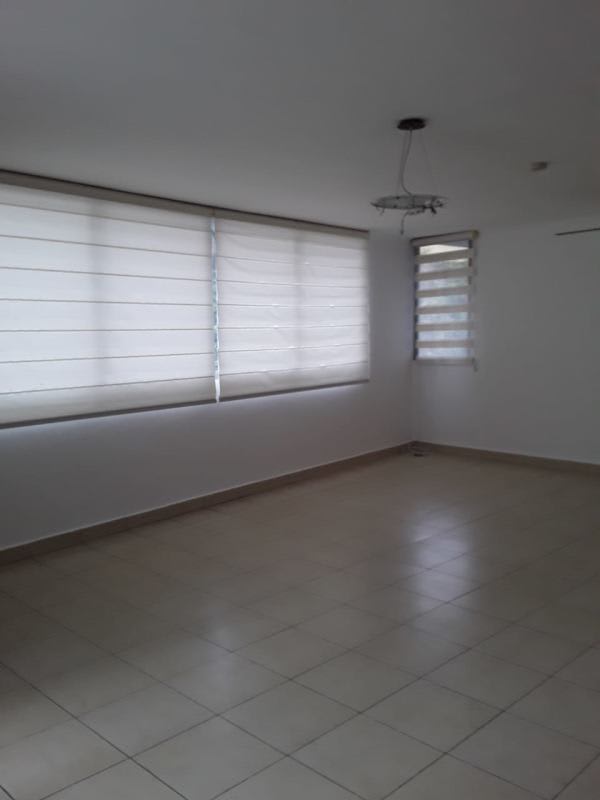 Bright bedroom with ceramic tile flooring and window PH Deluna Park Villa de las Fuentes Panama