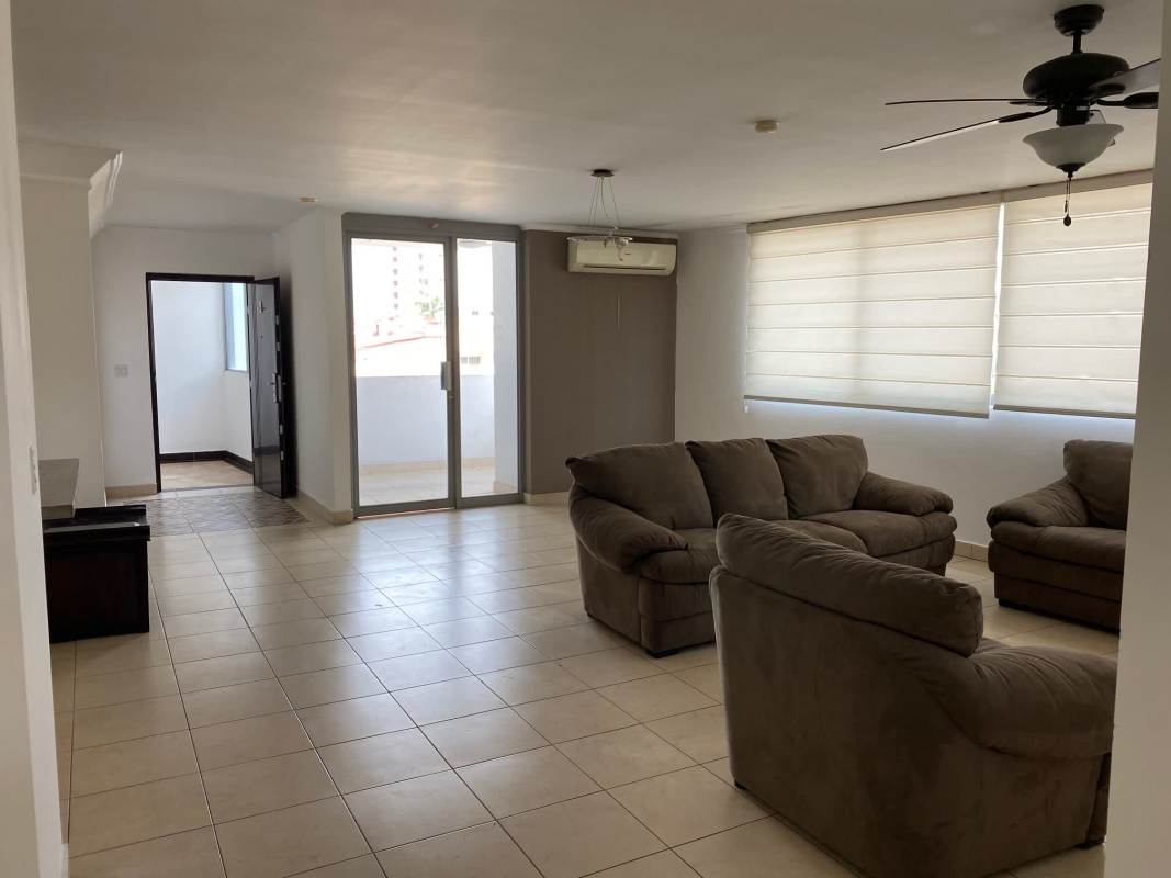 Modern kitchen with granite countertops, white cabinets, and laundry space PH Deluna Park Panama