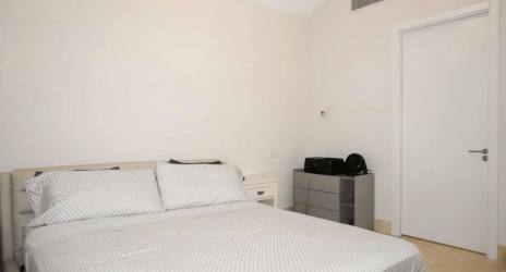 Minimalist bedroom with king size bed in luxury loft at Puntarena Buenaventura Panama