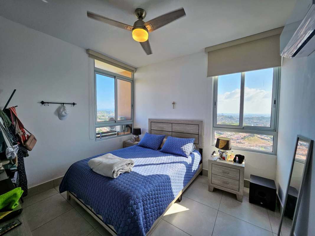 Bedroom with large windows and city view at PH Greenwood Tower Panama