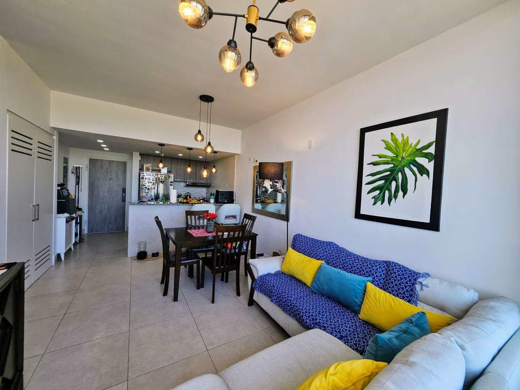 Modern integrated kitchen with granite countertop and breakfast bar at PH Greenwood Tower Panama