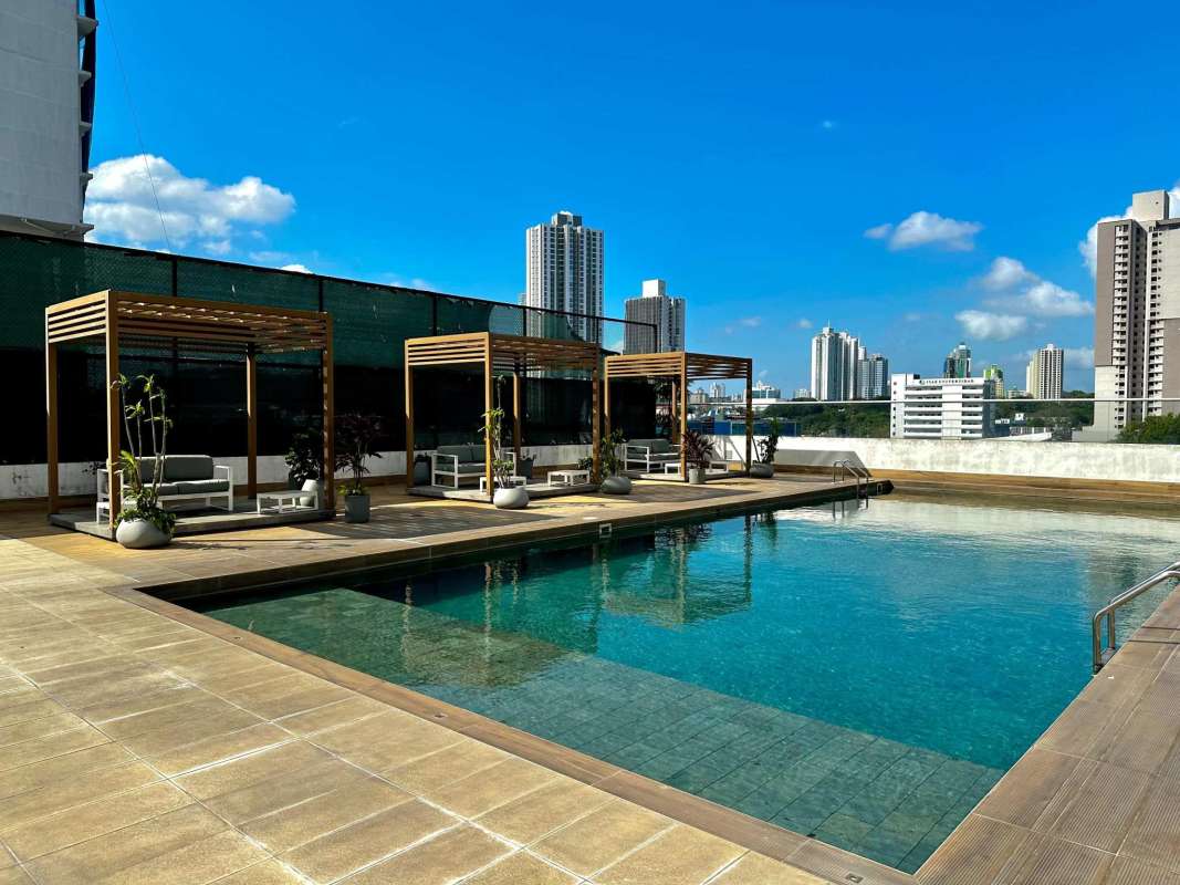Rooftop infinity pool with lounge areas at PH Greenwood Tower Panama City luxury condo