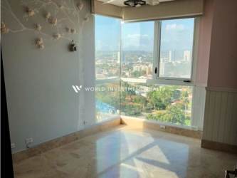 Bedroom with corner windows offering ocean and city view marble floor PH Punta Arenas