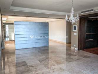 Living room with city view mirrored wall modern finishes PH Punta Arenas Panama