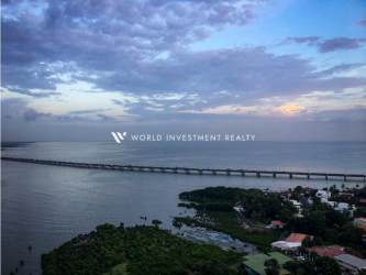 Aerial shot of Panama Bay coastline, Punta Pacifica skyscrapers, and iconic city bridge