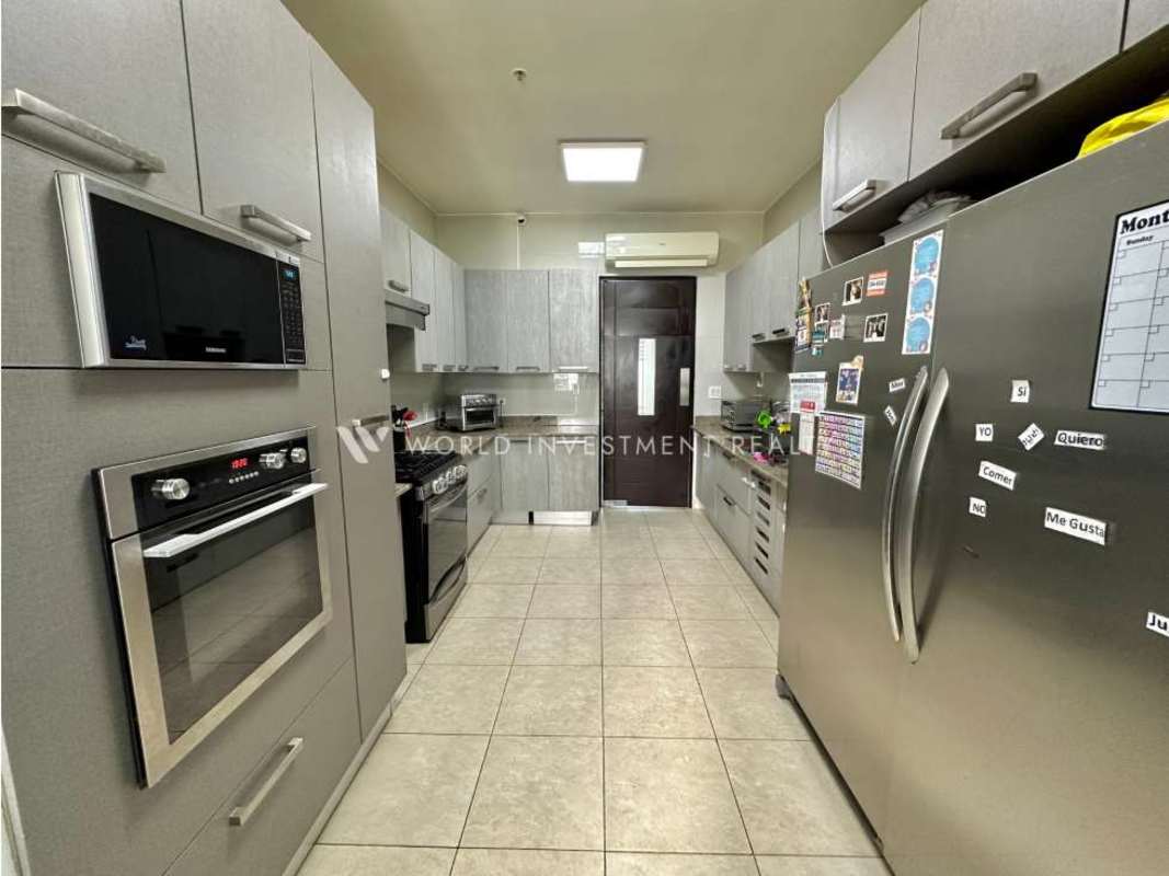 Dining room with marble floors, large windows and ocean view in PH Ocean Two