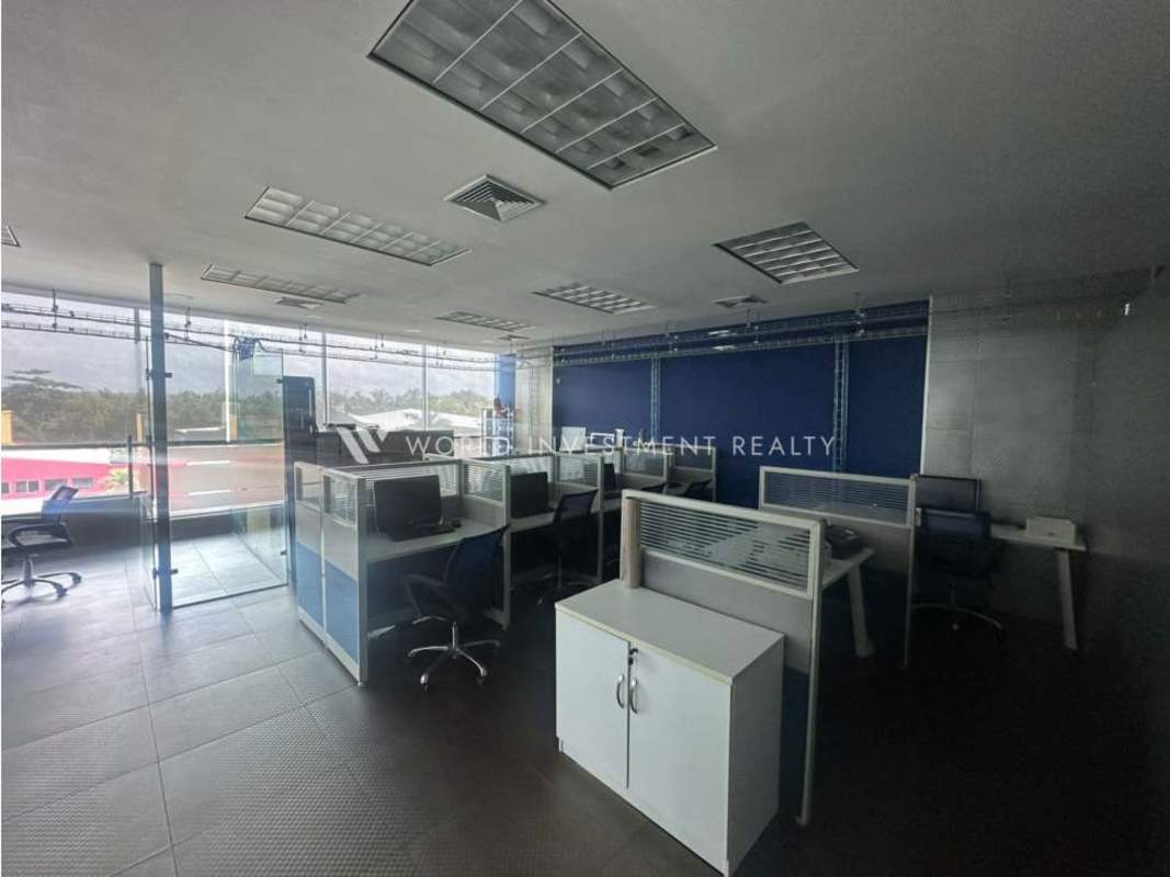 Open workspace area in modern office with glass divider and windows PH Ocean Business Plaza Costa del Este