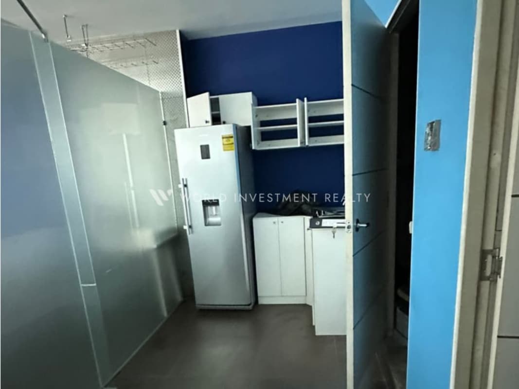 Open plan office space with glass walls tile floors large windows in PH Ocean Business Plaza Costa del Este