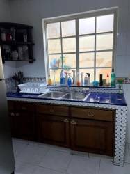 Large bedroom with AC, ceiling fan, blue accent wall at Residencial El Doral Panama Pacifico