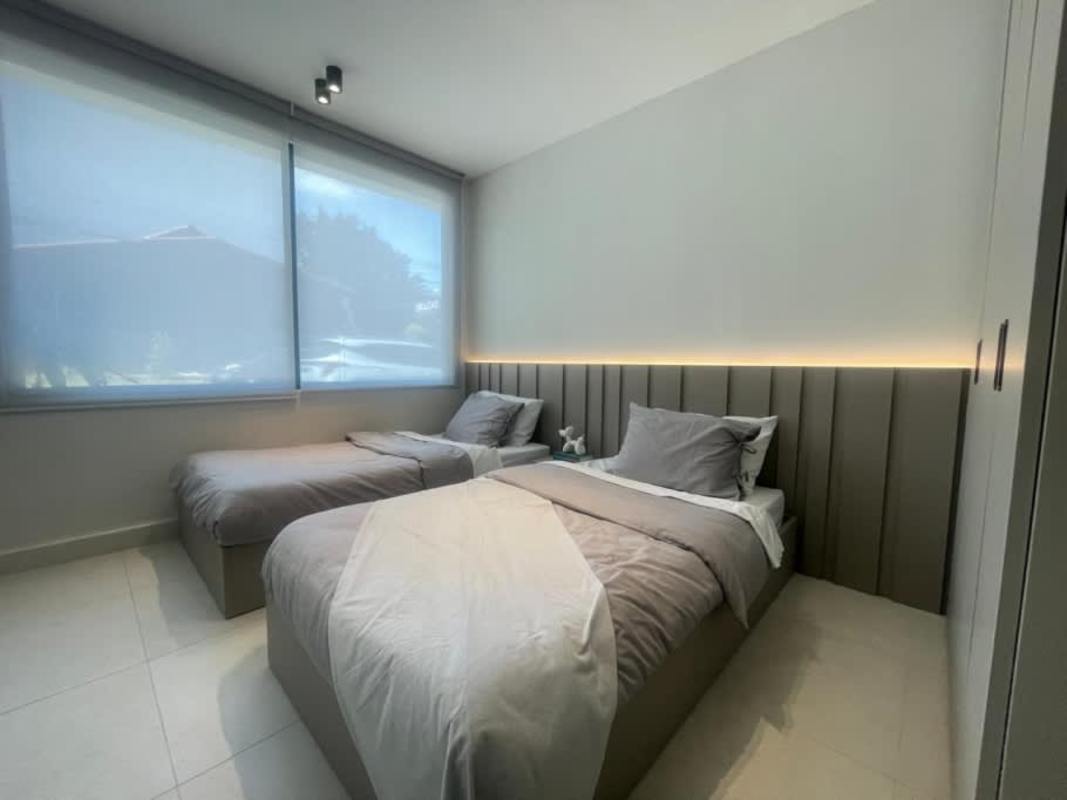 Modern bathroom with glass shower, black fixtures at PH Coco del Mar Panama