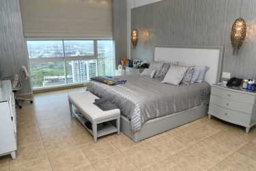 Contemporary bedroom with closet and large mirror Titanium Tower Panama City