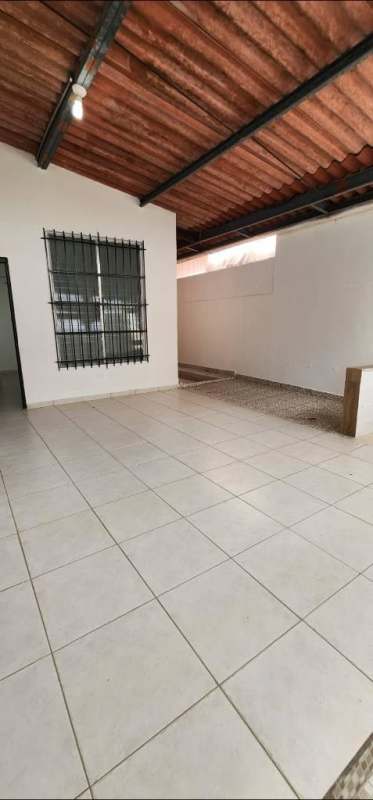 Covered side terrace patio and walkway of fenced rental house in Brisas del Golf Panama City