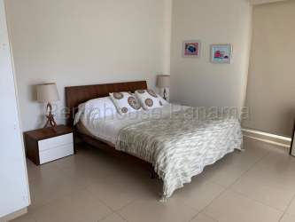 Contemporary second bedroom with large window Playa Blanca oceanfront apartment Panama
