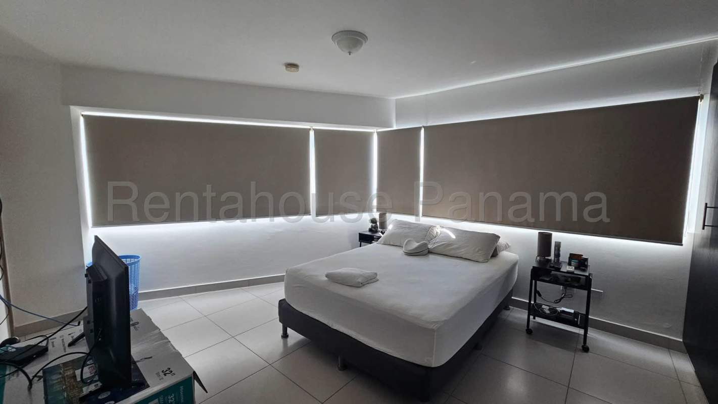 Minimalist bedroom with natural light and city views at PH San Francisco Tower