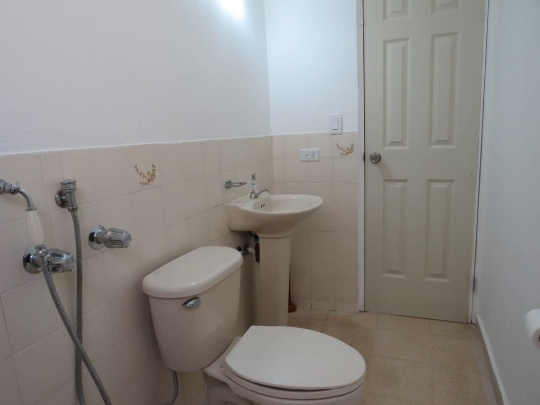 Bathroom with pedestal sink toilet and tiled shower in Residencial La Loma Panama City