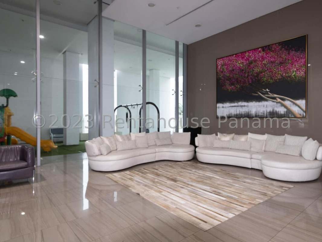 Spacious bedroom with large window overlooking city skyline at PH Santorini Coco del Mar Panama City