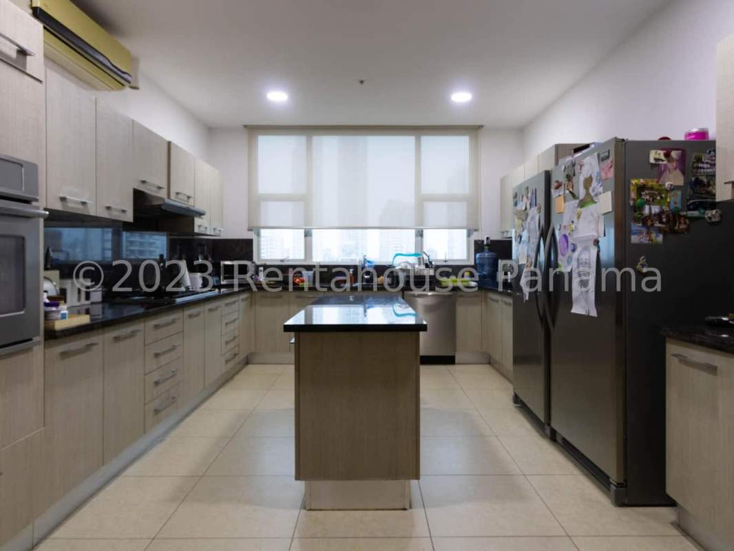 Modern gym with fitness equipment and city views in PH Santorini Coco del Mar Panama