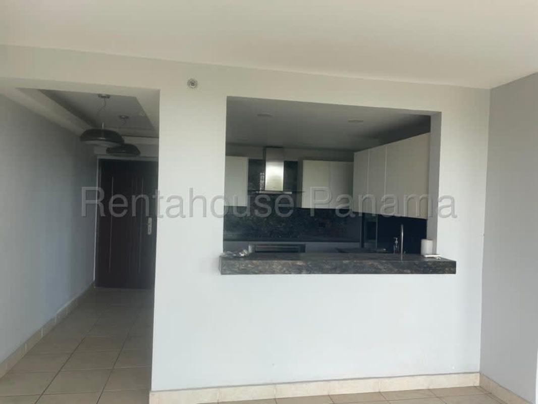 Outdoor swimming pool with lounge and gardens at Clayton Park Residences in Panama City